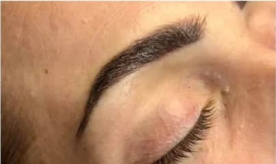 Soft powder brow on closed eye